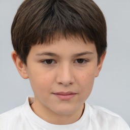 Joyful white child female with short  brown hair and brown eyes