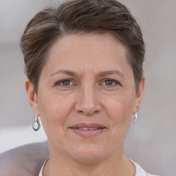 Joyful white adult female with short  brown hair and brown eyes