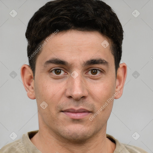 Joyful white young-adult male with short  brown hair and grey eyes