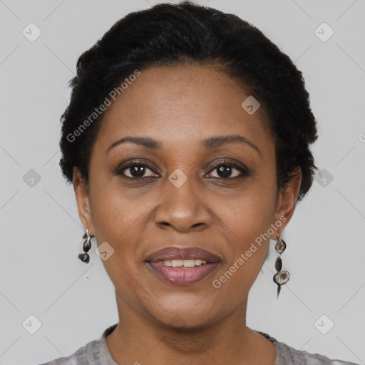 Joyful black adult female with short  brown hair and brown eyes