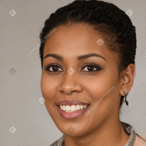 Joyful black young-adult female with short  brown hair and brown eyes