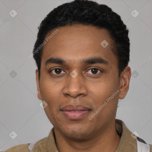 Joyful black young-adult male with short  black hair and brown eyes