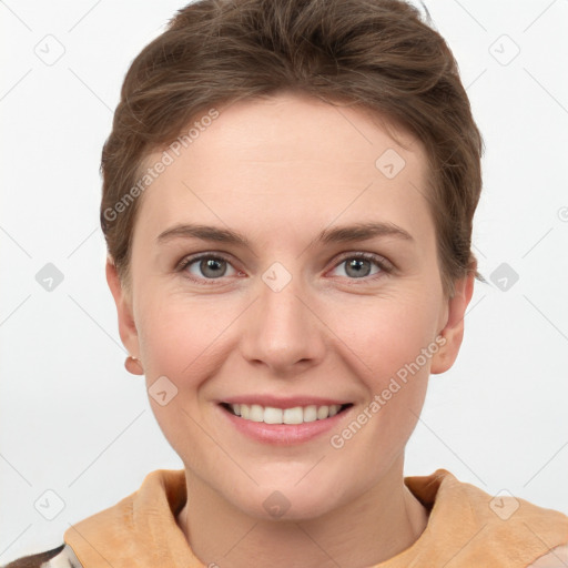 Joyful white young-adult female with short  brown hair and grey eyes