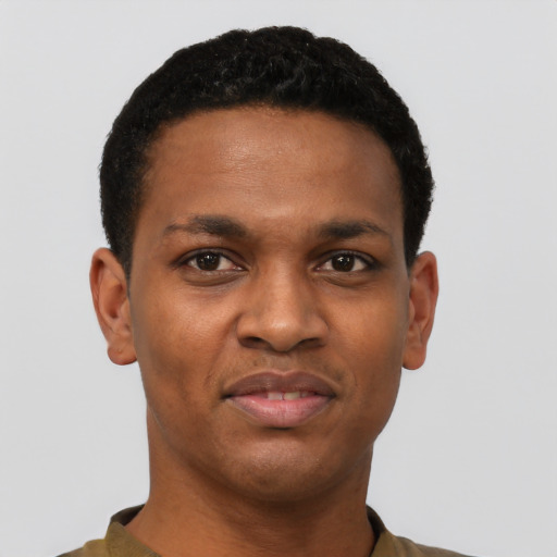 Joyful black young-adult male with short  black hair and brown eyes
