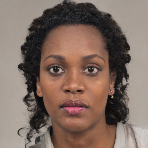 Neutral black young-adult female with medium  black hair and brown eyes