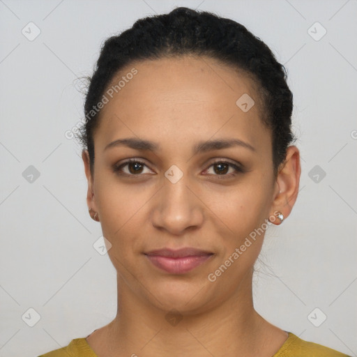 Joyful latino young-adult female with short  black hair and brown eyes