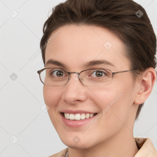 Joyful white young-adult female with short  brown hair and grey eyes