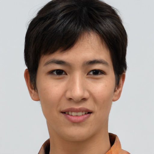 Joyful asian young-adult female with short  brown hair and brown eyes