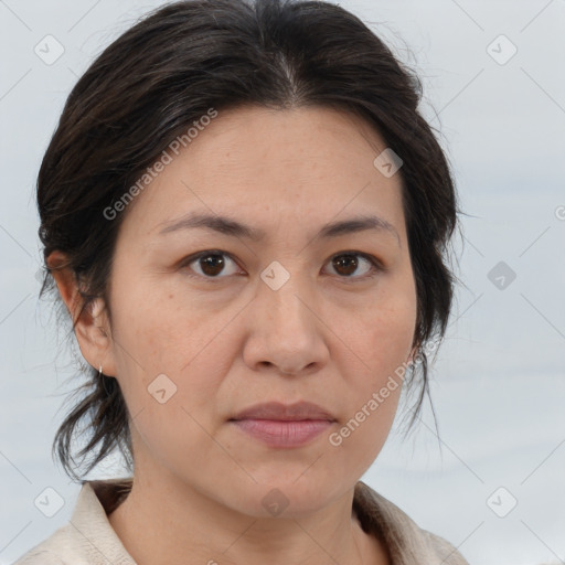 Joyful white adult female with medium  brown hair and brown eyes