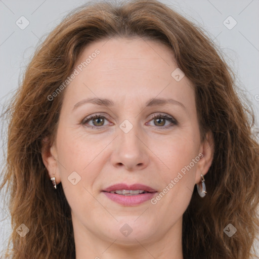 Joyful white adult female with long  brown hair and brown eyes