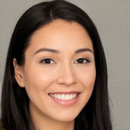 Joyful white young-adult female with long  black hair and brown eyes