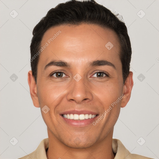 Joyful white young-adult male with short  black hair and brown eyes