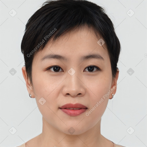 Joyful asian young-adult female with short  brown hair and brown eyes