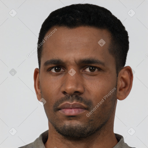 Neutral latino young-adult male with short  black hair and brown eyes
