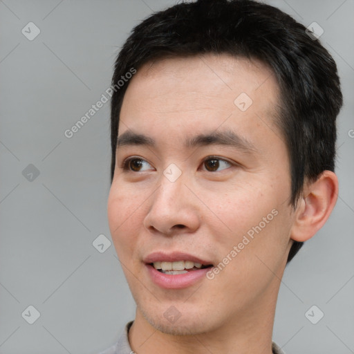 Joyful white young-adult male with short  black hair and brown eyes