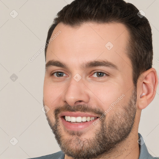 Joyful white young-adult male with short  brown hair and brown eyes