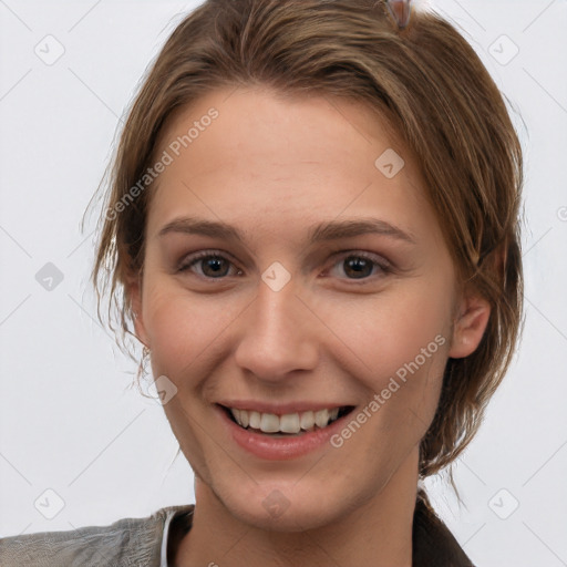 Joyful white young-adult female with medium  brown hair and brown eyes