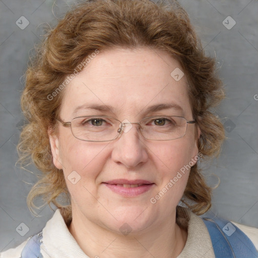 Joyful white adult female with medium  brown hair and blue eyes