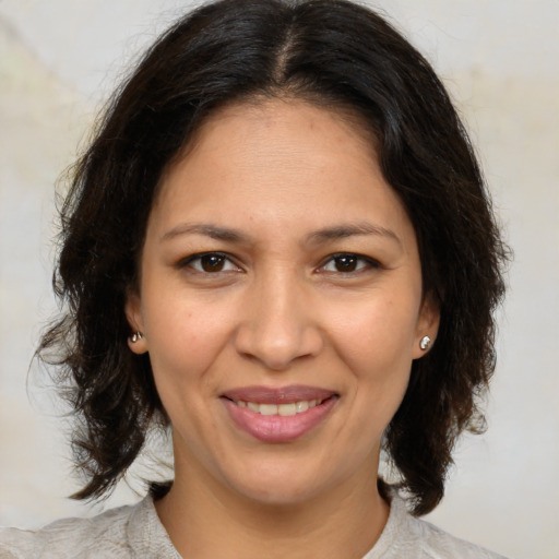 Joyful white adult female with medium  brown hair and brown eyes