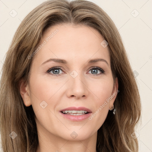 Joyful white adult female with long  brown hair and grey eyes