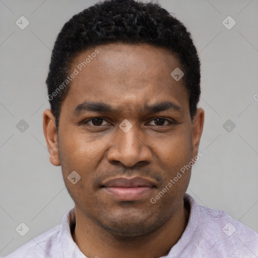 Joyful latino adult male with short  black hair and brown eyes