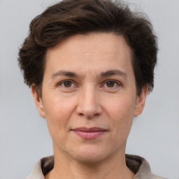 Joyful white adult female with short  brown hair and brown eyes