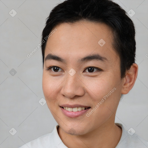 Joyful asian young-adult male with short  black hair and brown eyes