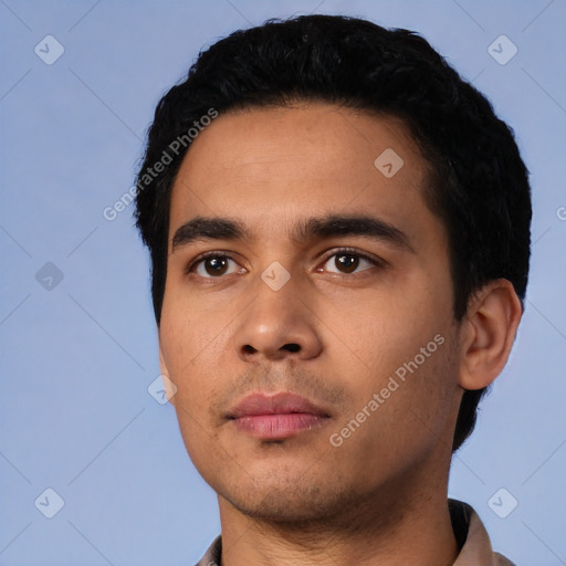 Neutral latino young-adult male with short  black hair and brown eyes