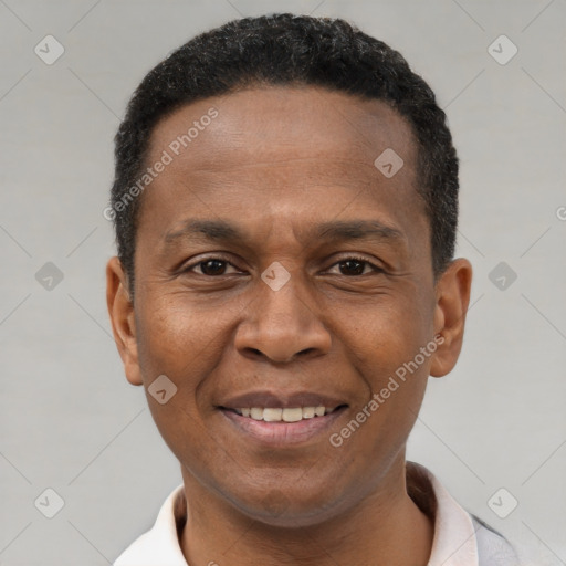 Joyful latino young-adult male with short  brown hair and brown eyes