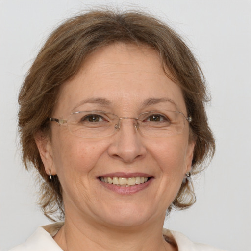 Joyful white middle-aged female with medium  brown hair and brown eyes