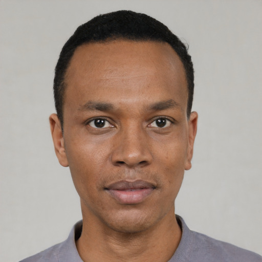 Neutral black young-adult male with short  black hair and brown eyes