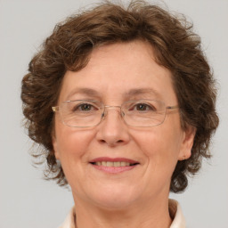 Joyful white middle-aged female with medium  brown hair and brown eyes