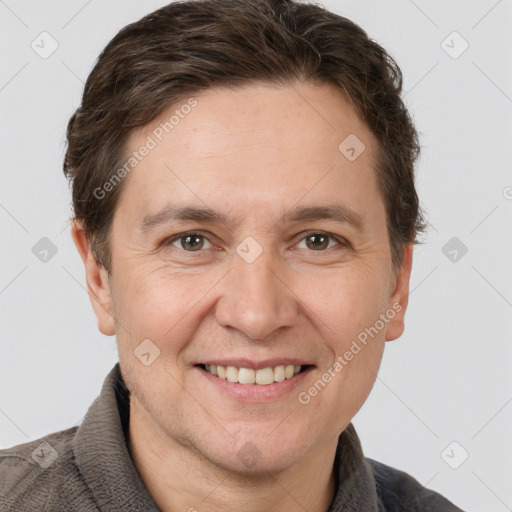 Joyful white adult male with short  brown hair and grey eyes