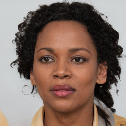Neutral black adult female with medium  brown hair and brown eyes