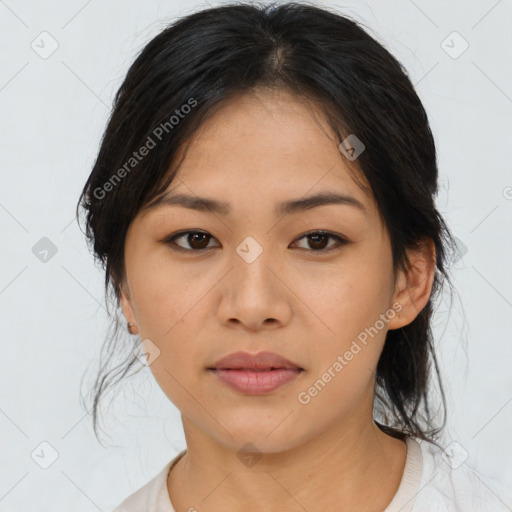 Joyful asian young-adult female with medium  black hair and brown eyes