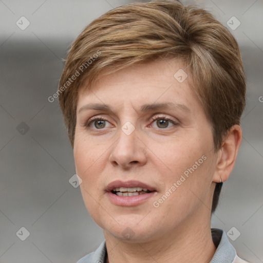 Joyful white adult female with short  brown hair and grey eyes