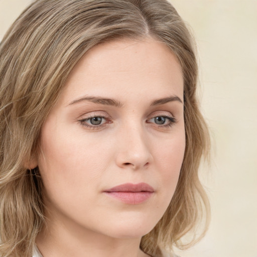 Neutral white young-adult female with long  brown hair and green eyes