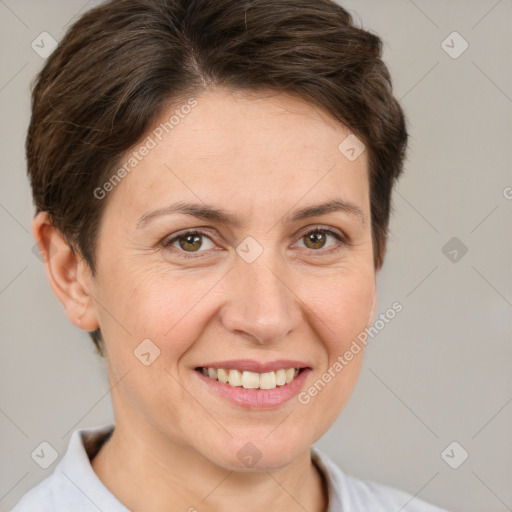 Joyful white adult female with short  brown hair and brown eyes