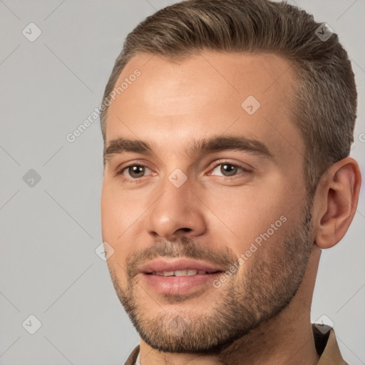 Joyful white young-adult male with short  brown hair and brown eyes