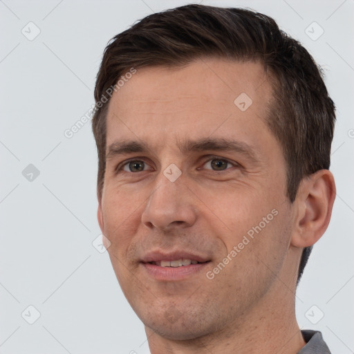 Joyful white adult male with short  brown hair and brown eyes