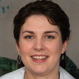 Joyful white adult female with medium  brown hair and brown eyes