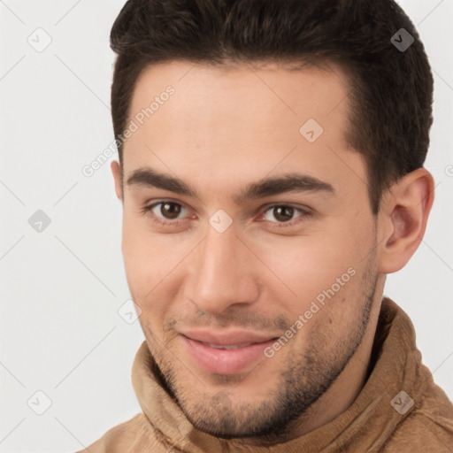 Joyful white young-adult male with short  brown hair and brown eyes