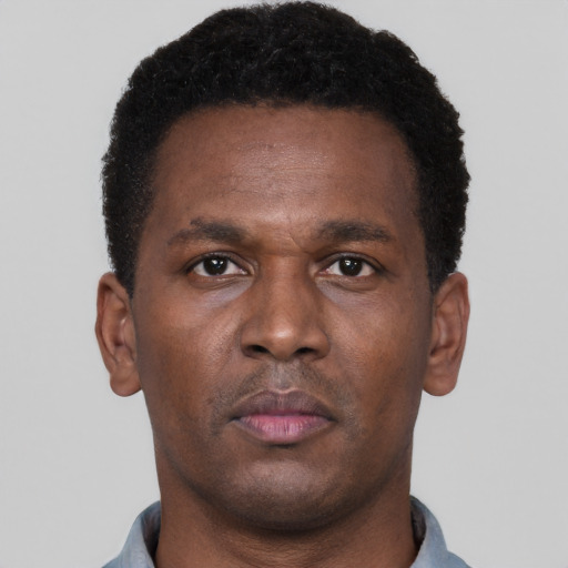Neutral black young-adult male with short  brown hair and brown eyes