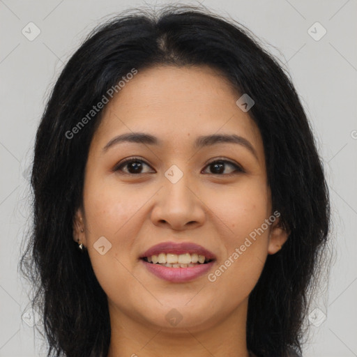 Joyful latino young-adult female with long  brown hair and brown eyes