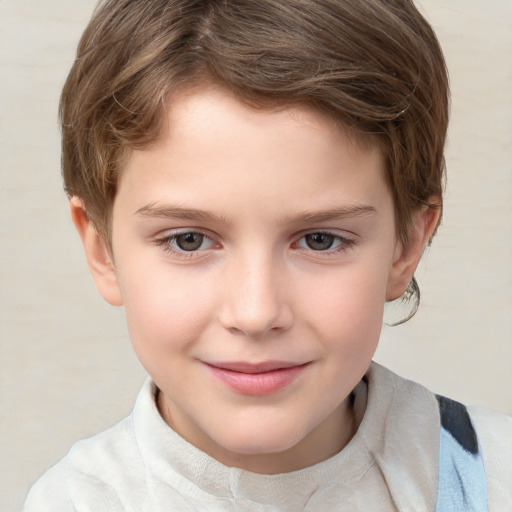 Joyful white child male with short  brown hair and grey eyes