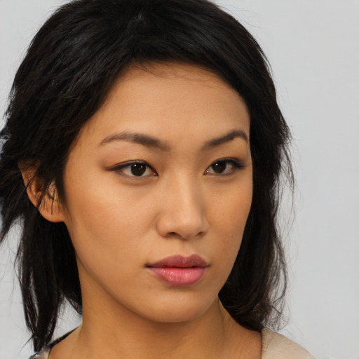 Neutral asian young-adult female with medium  brown hair and brown eyes