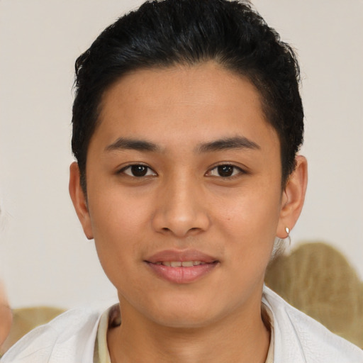 Joyful latino young-adult female with short  black hair and brown eyes