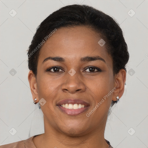 Joyful black young-adult female with short  brown hair and brown eyes