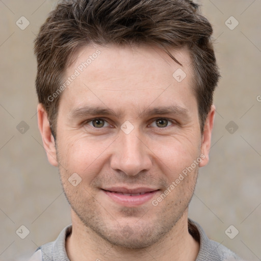 Joyful white adult male with short  brown hair and grey eyes