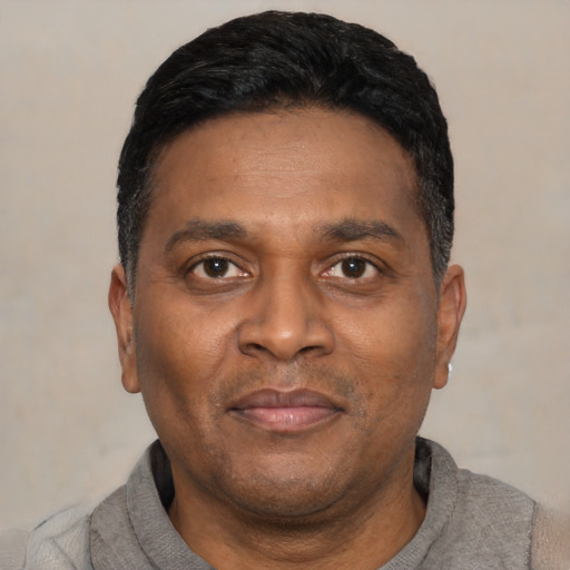 Neutral latino adult male with short  black hair and brown eyes